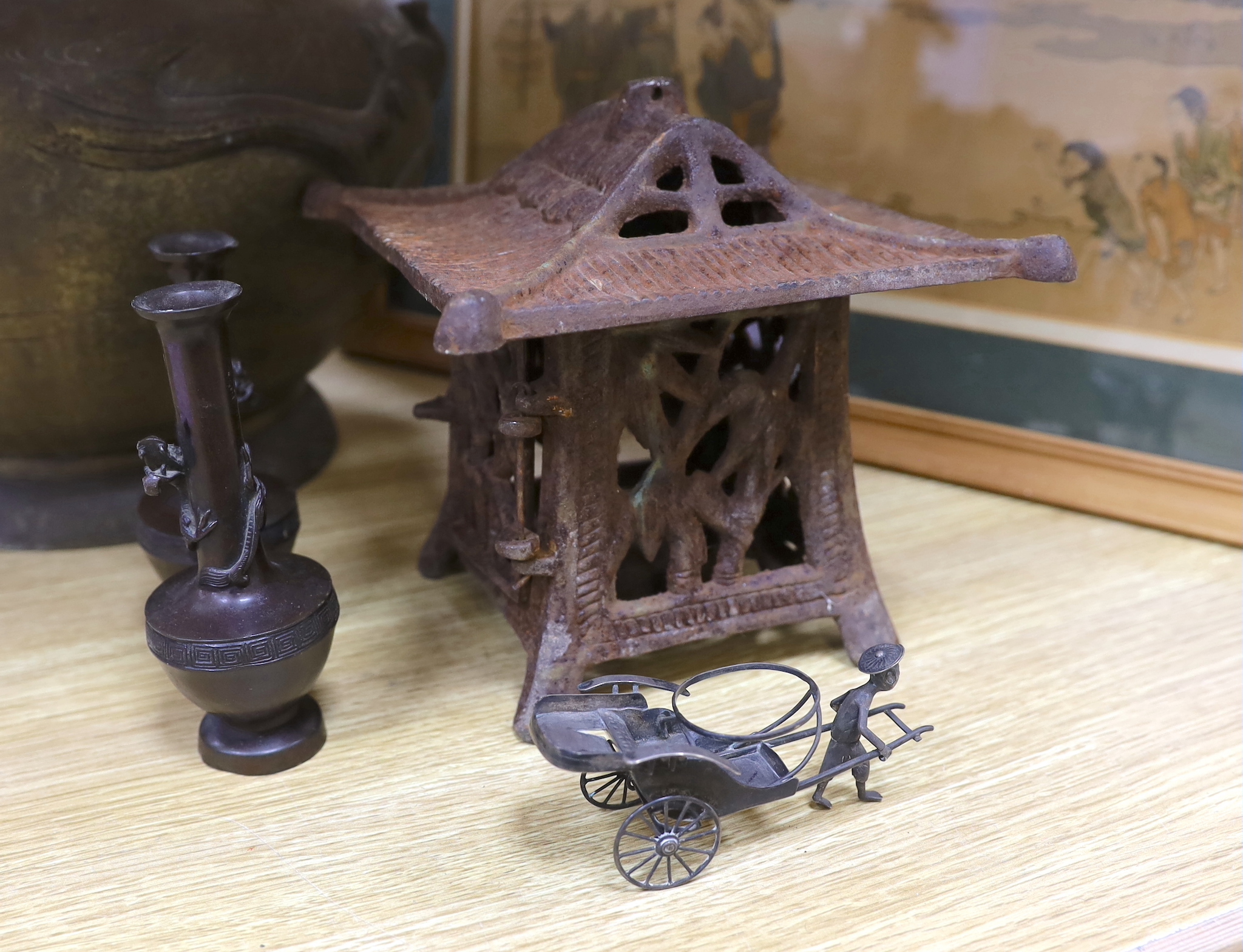 A Japanese bronze jardiniere, a similar pair of small bottle vases, a Japanese cast-iron lantern, a Japanese print, and a Chinese silver model of a rickshaw